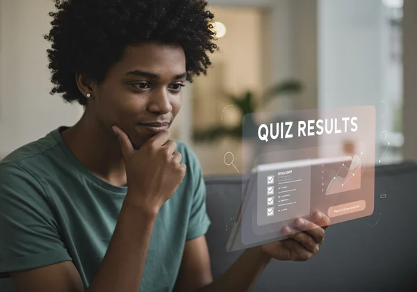 Person reflecting on a quiz result, feeling relief or confusion.